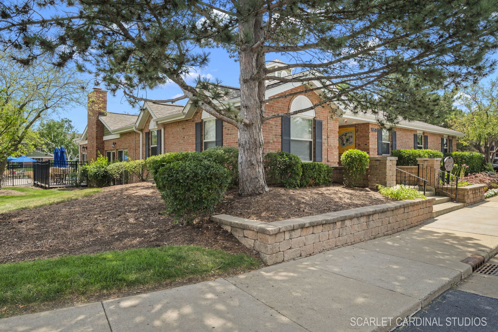 1300 McDowell Road, Unit 203 Naperville, IL 60563 - Photo 21 of 21 a view of a building with a tree