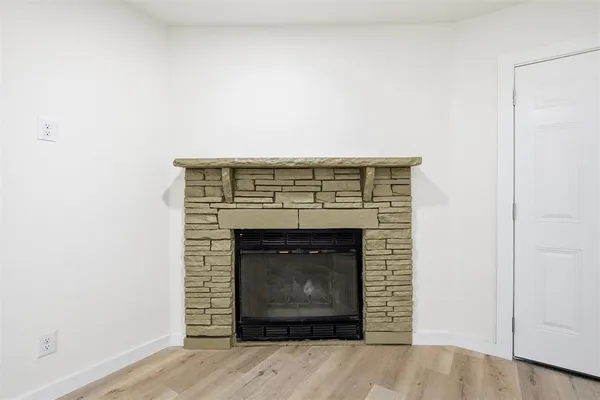 an empty room with a fireplace