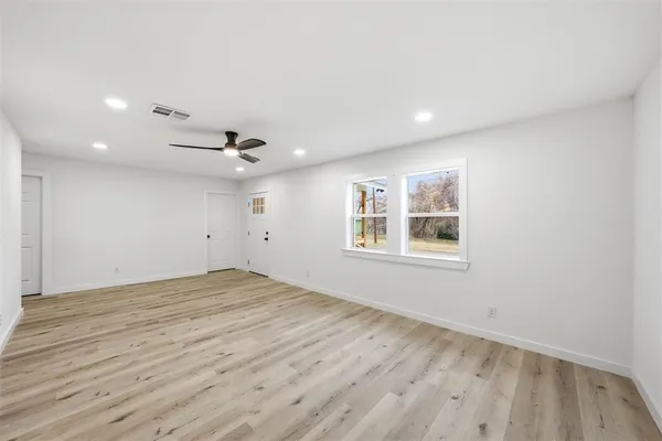 a view of an empty room with a window