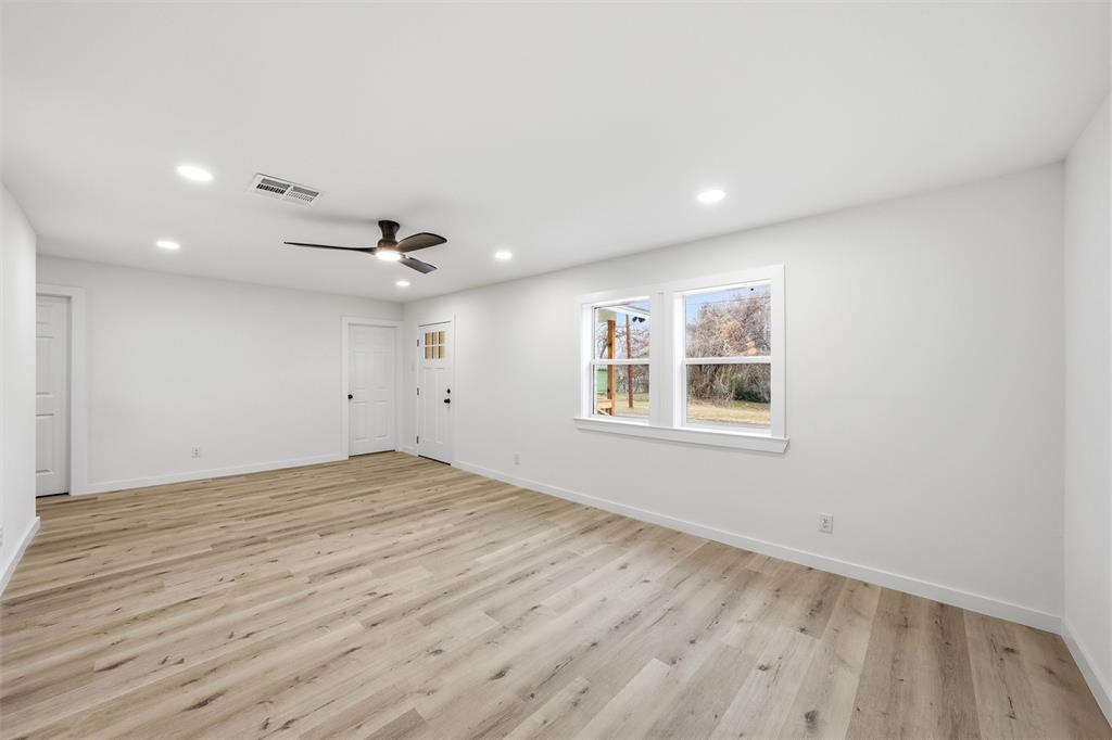 1221 Chestnut Street Waco, TX 76704 - Photo 6 of 32 a view of an empty room with a window