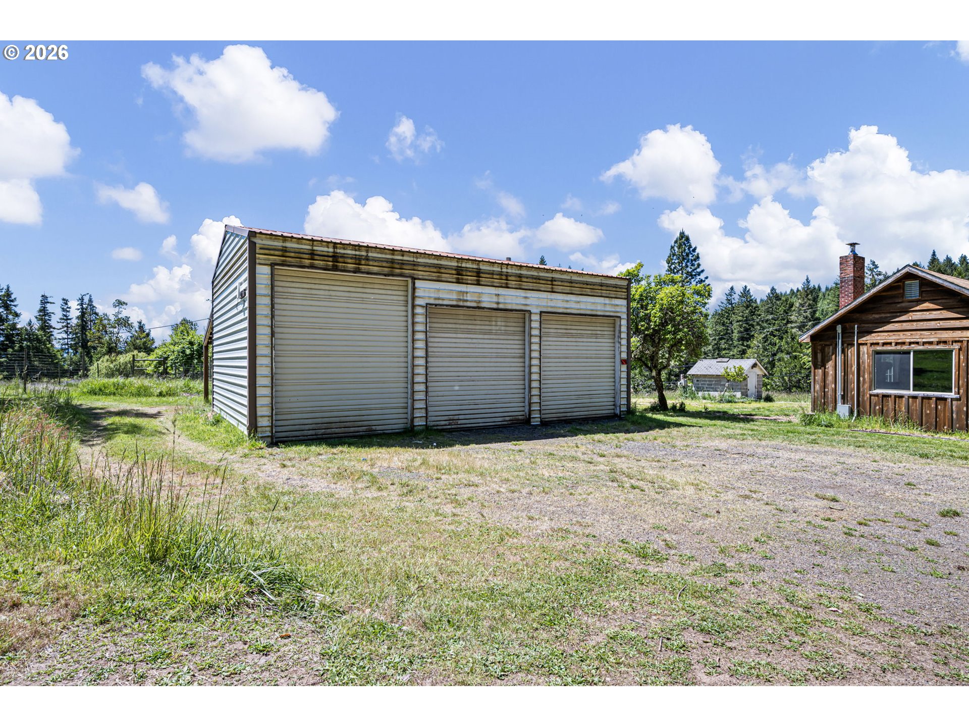 77521 Brock Road Oakridge, OR 97463 - Photo 46 of 48 a front view of a house with a yard and garage