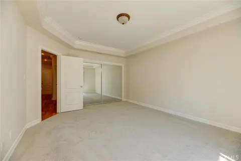a view of an empty room and closet