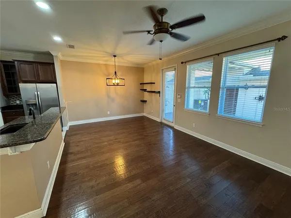 a view of a kitchen with a sink and a stove top oven