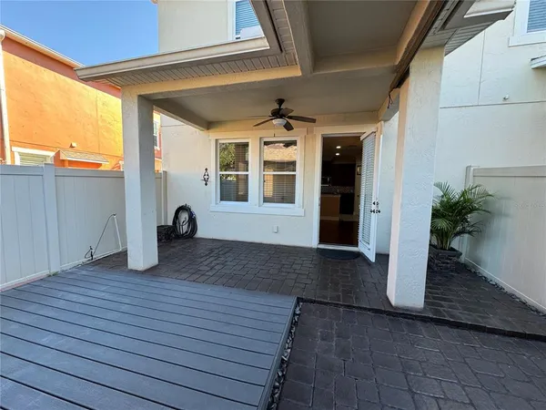 a view of a porch with wooden floor and fence