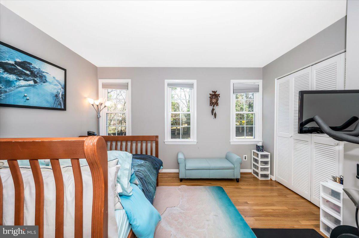 8803 Postoak Road Potomac, MD 20854 - Photo 36 of 66 a bedroom with furniture and a flat screen tv