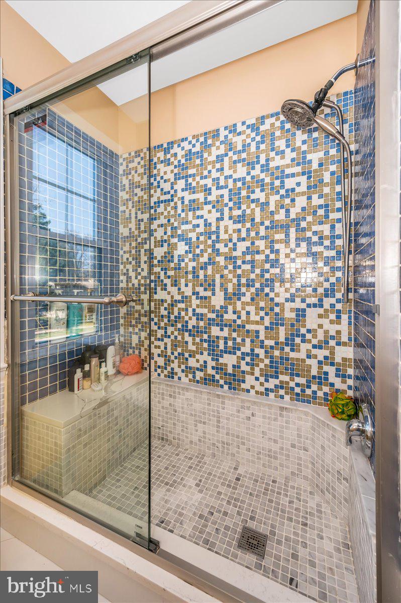 8803 Postoak Road Potomac, MD 20854 - Photo 39 of 66 a bathroom with a shower