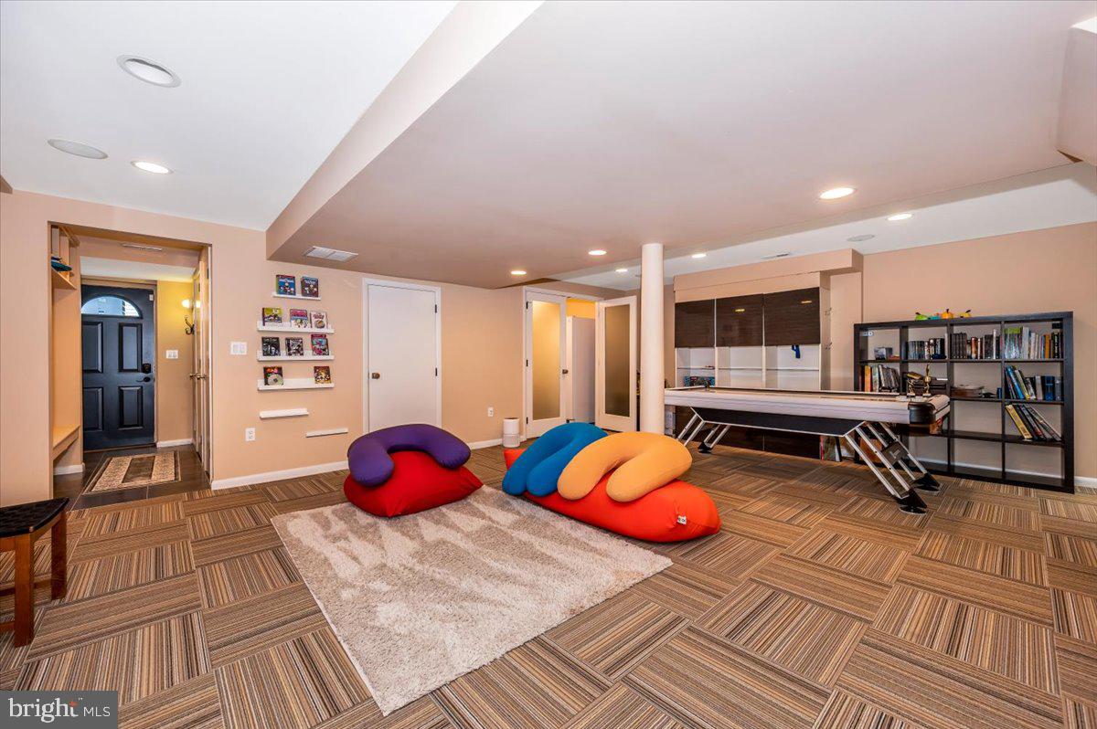 8803 Postoak Road Potomac, MD 20854 - Photo 44 of 66 a living room with furniture and wooden floor