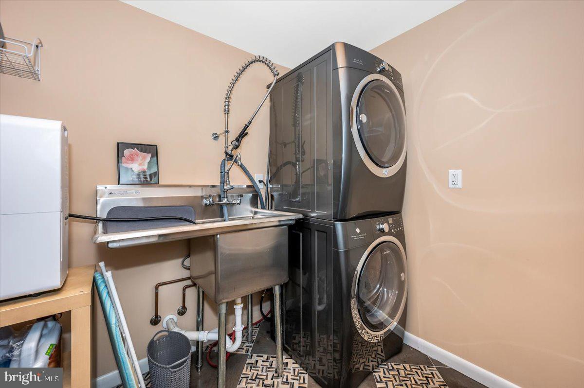 8803 Postoak Road Potomac, MD 20854 - Photo 49 of 66 a utility room with dryer and washer