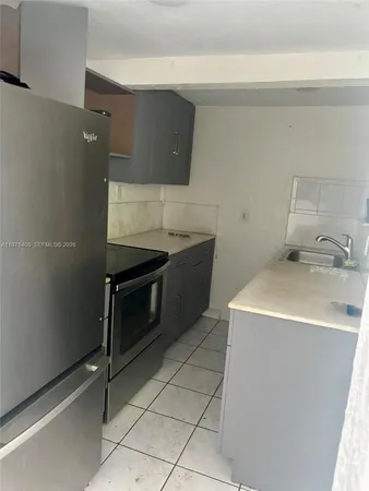 a utility room with washer and dryer