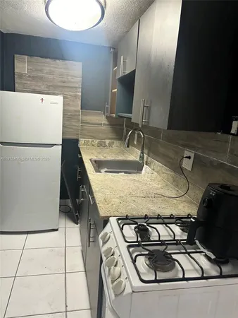 a utility room with washer and dryer