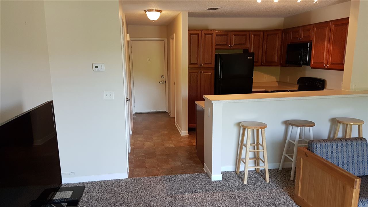 1330 Hunters Road, Unit H Harrisonburg, VA 22801 - Photo 10 of 22 a view of a kitchen with fridge and workspace