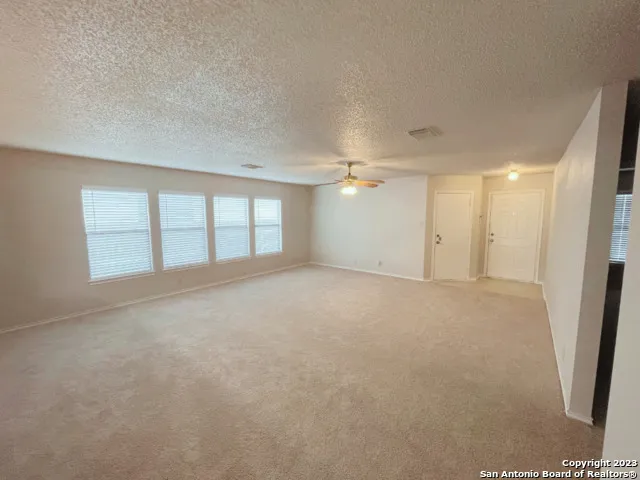 a view of an empty room with a window