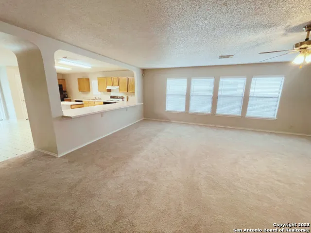 a view of an empty room with a window