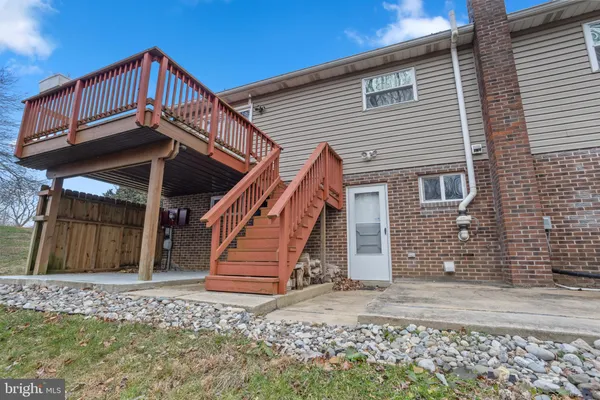 a view of a house with wooden stairs