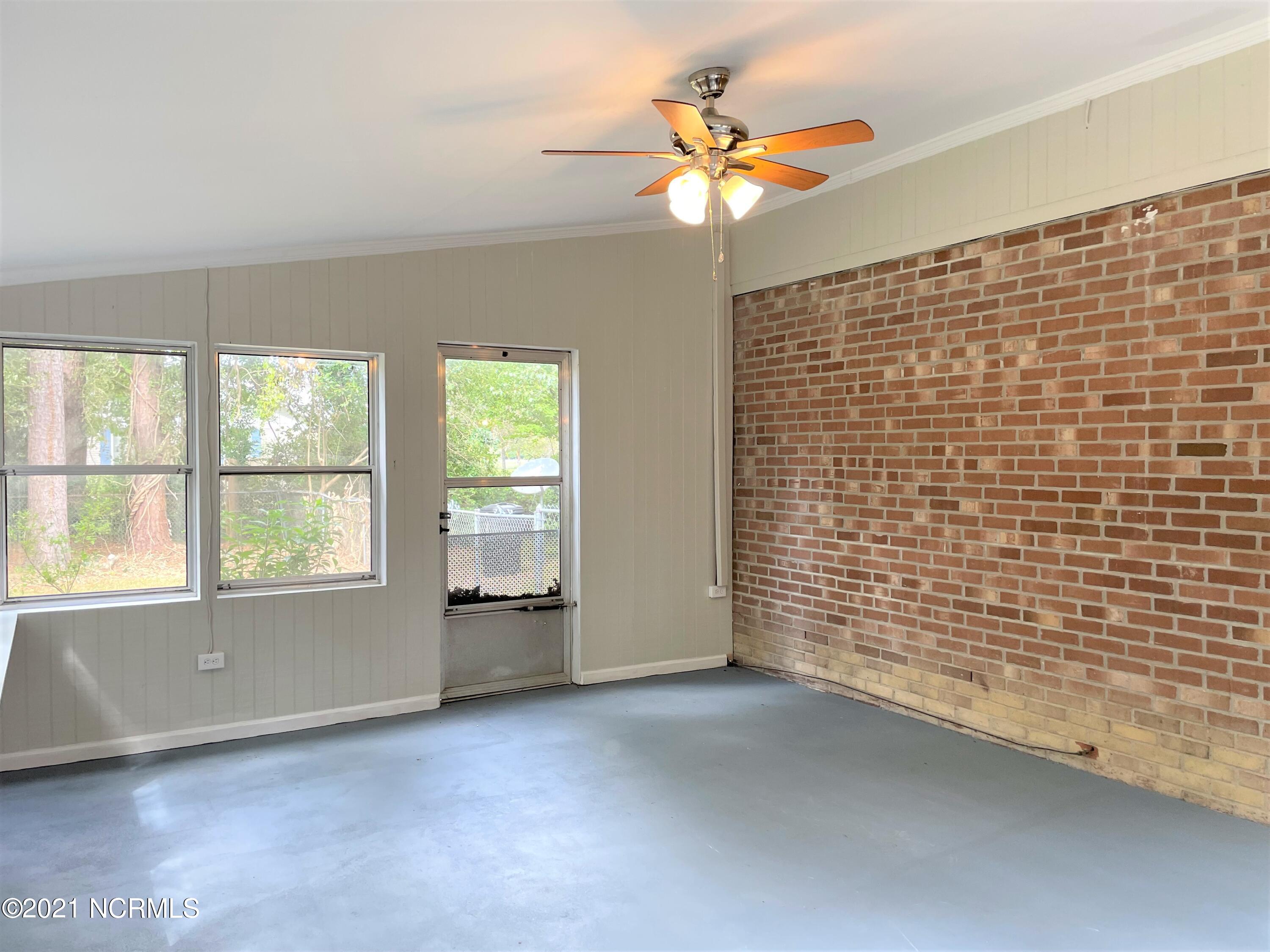 1285 Old Maplehurst Road Jacksonville, NC 28540 - Photo 27 of 32 sunroom 2