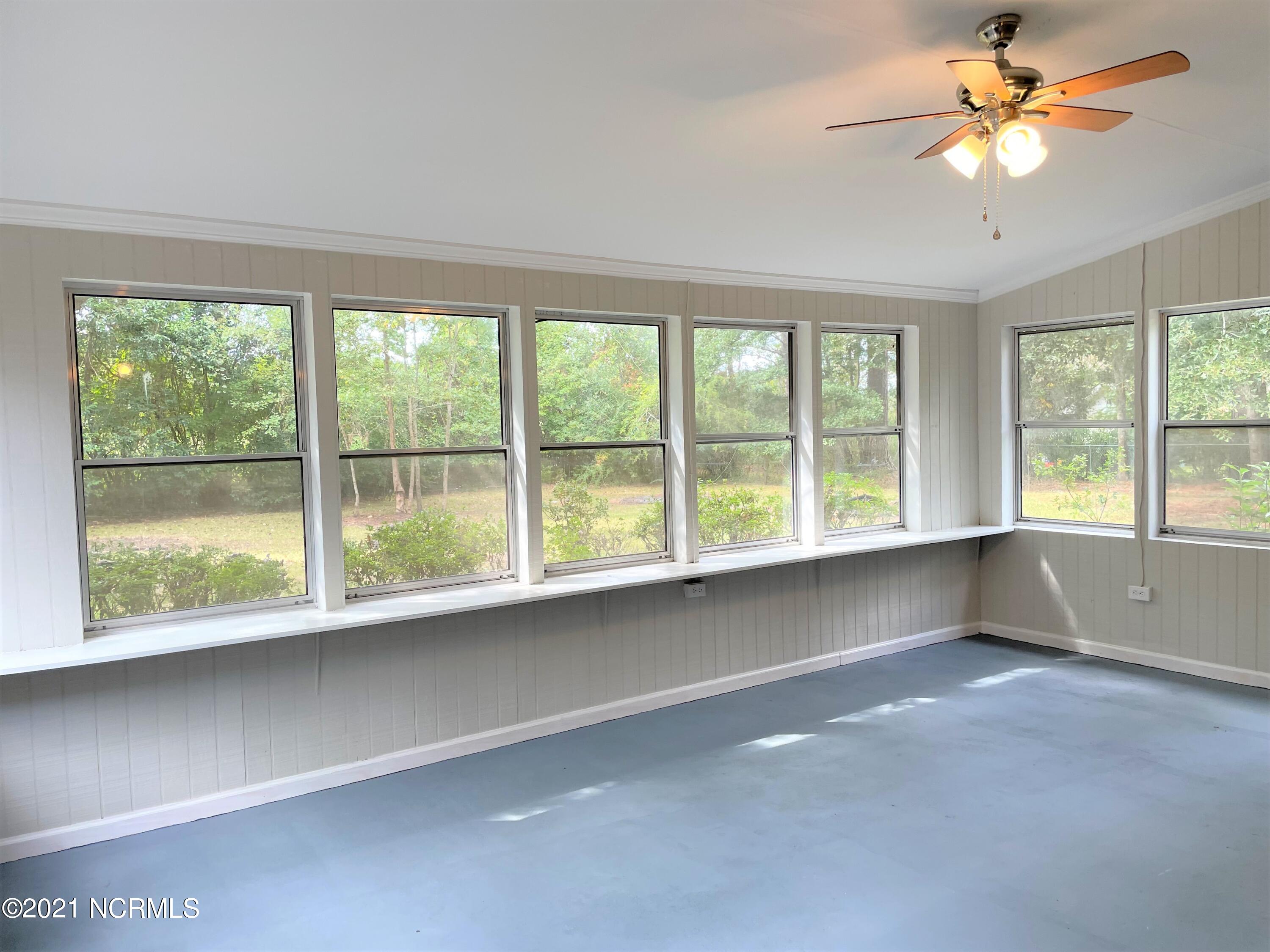 1285 Old Maplehurst Road Jacksonville, NC 28540 - Photo 28 of 32 sunroom 3
