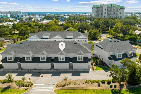 a aerial view of a house with a yard