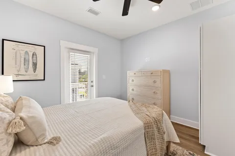 a bedroom with a bed and a couch