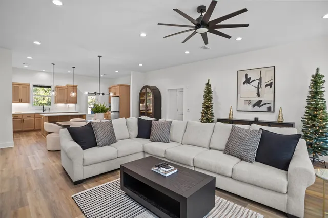 a living room with furniture and a large window