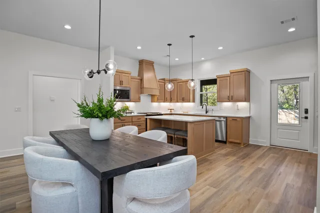 a kitchen with a table and chairs in it