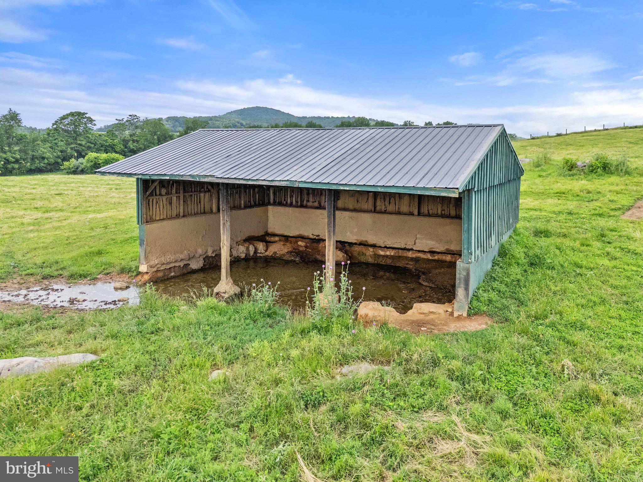 10674 Ada Road Marshall, VA 20115 - Photo 19 of 35 a backyard of a house with table and chairs