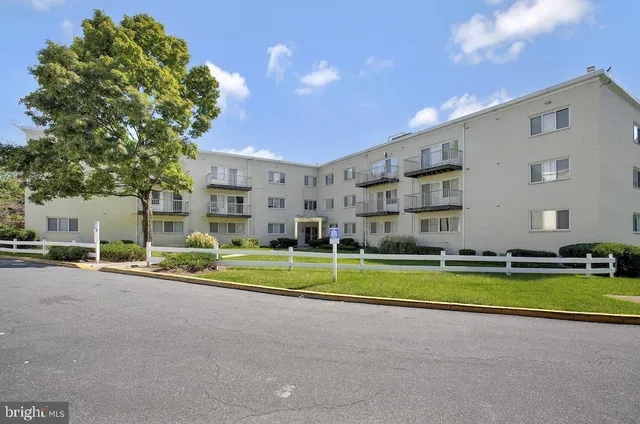 a view of a house with a swimming pool and a yard