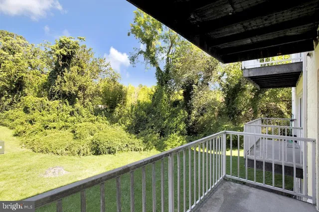 a view of a balcony with furniture