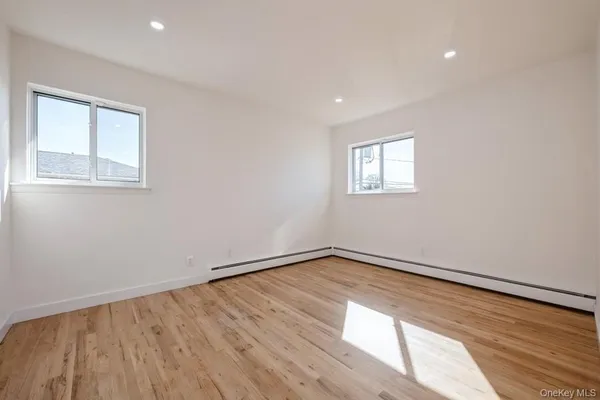 a view of a wooden deck with chairs