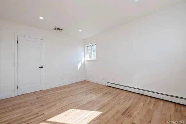 a view of house with deck and outdoor seating