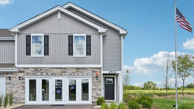 a view of a house with yard and plants