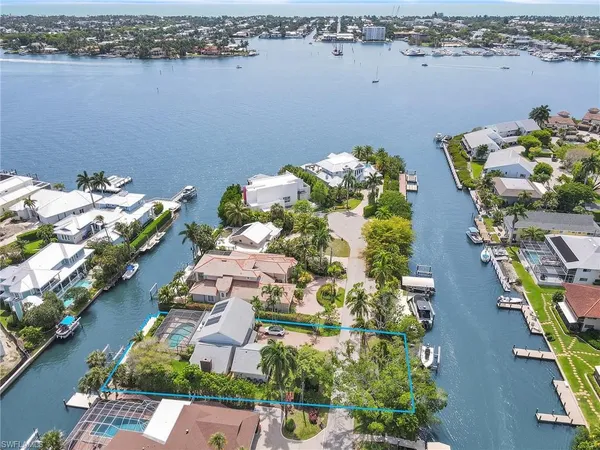 an aerial view of a house with a lake view