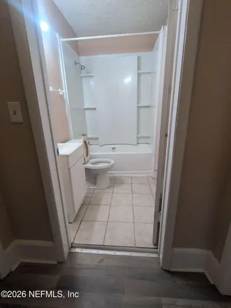 a view of bathroom with a sink and a mirror