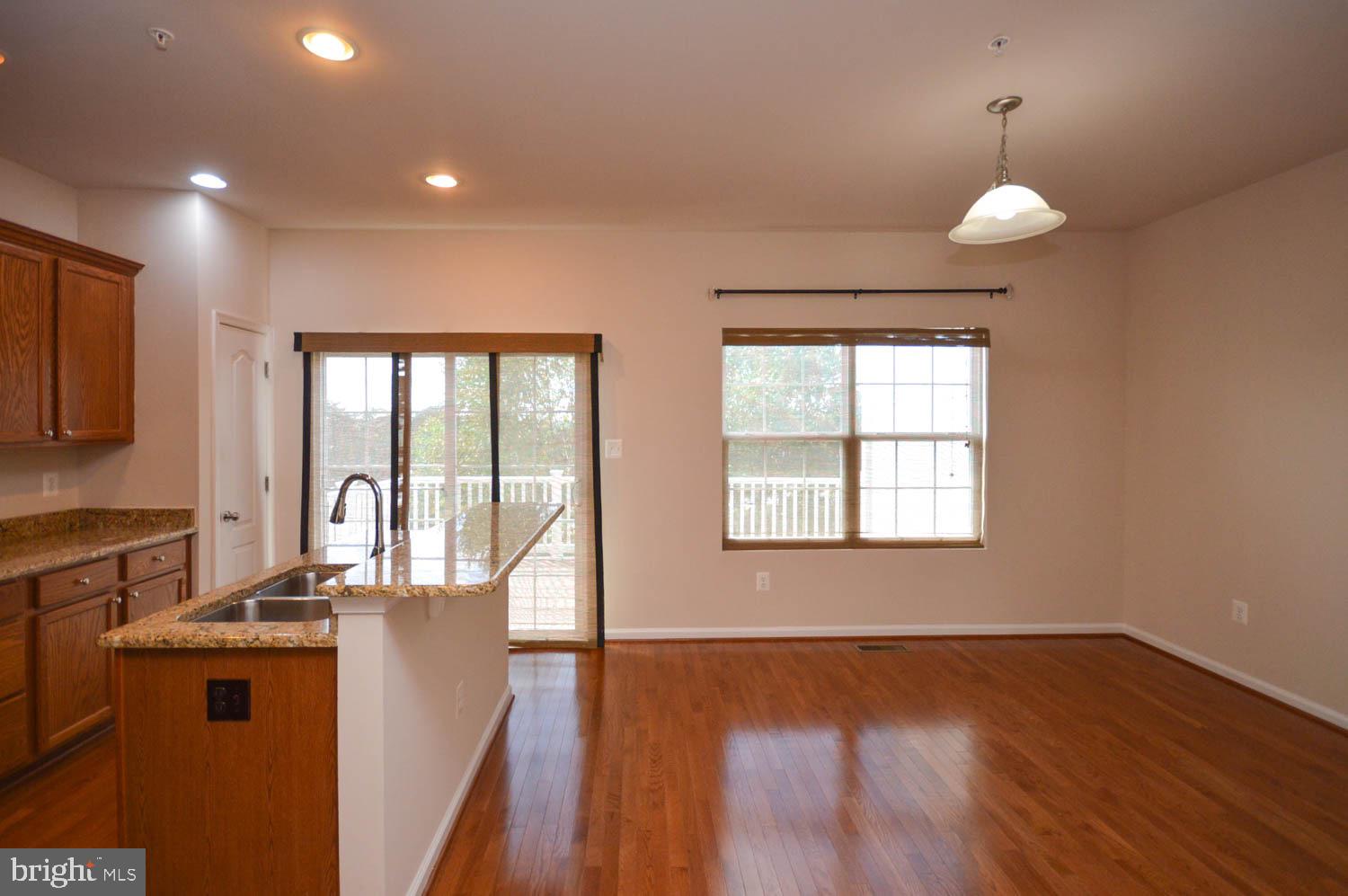 8426 Winding Trail Laurel, MD 20724 - Photo 12 of 41 a view of a kitchen counter top space and wooden floor