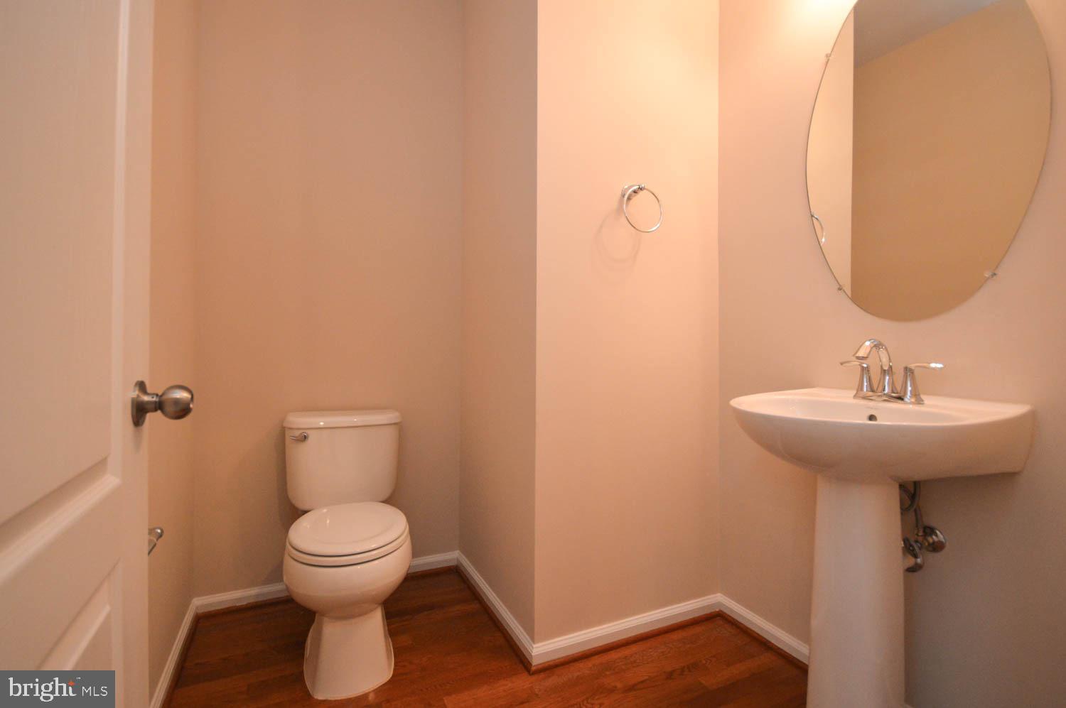 8426 Winding Trail Laurel, MD 20724 - Photo 20 of 41 a bathroom with a toilet sink and mirror