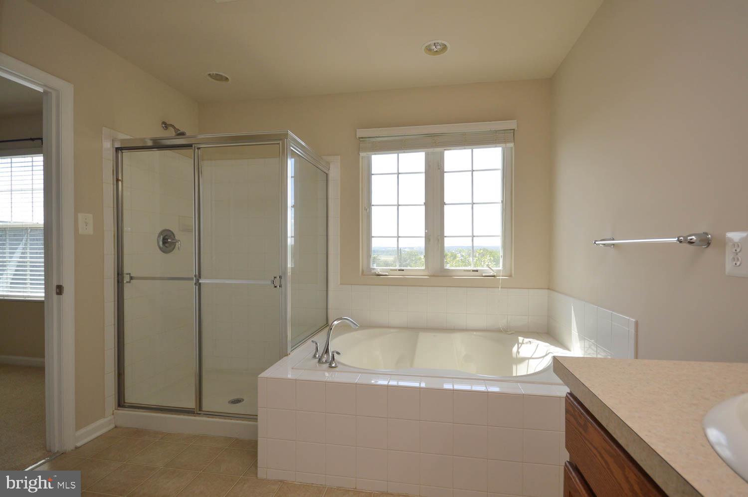 8426 Winding Trail Laurel, MD 20724 - Photo 27 of 41 a bathroom with a granite countertop bathtub sink vanity and toilet