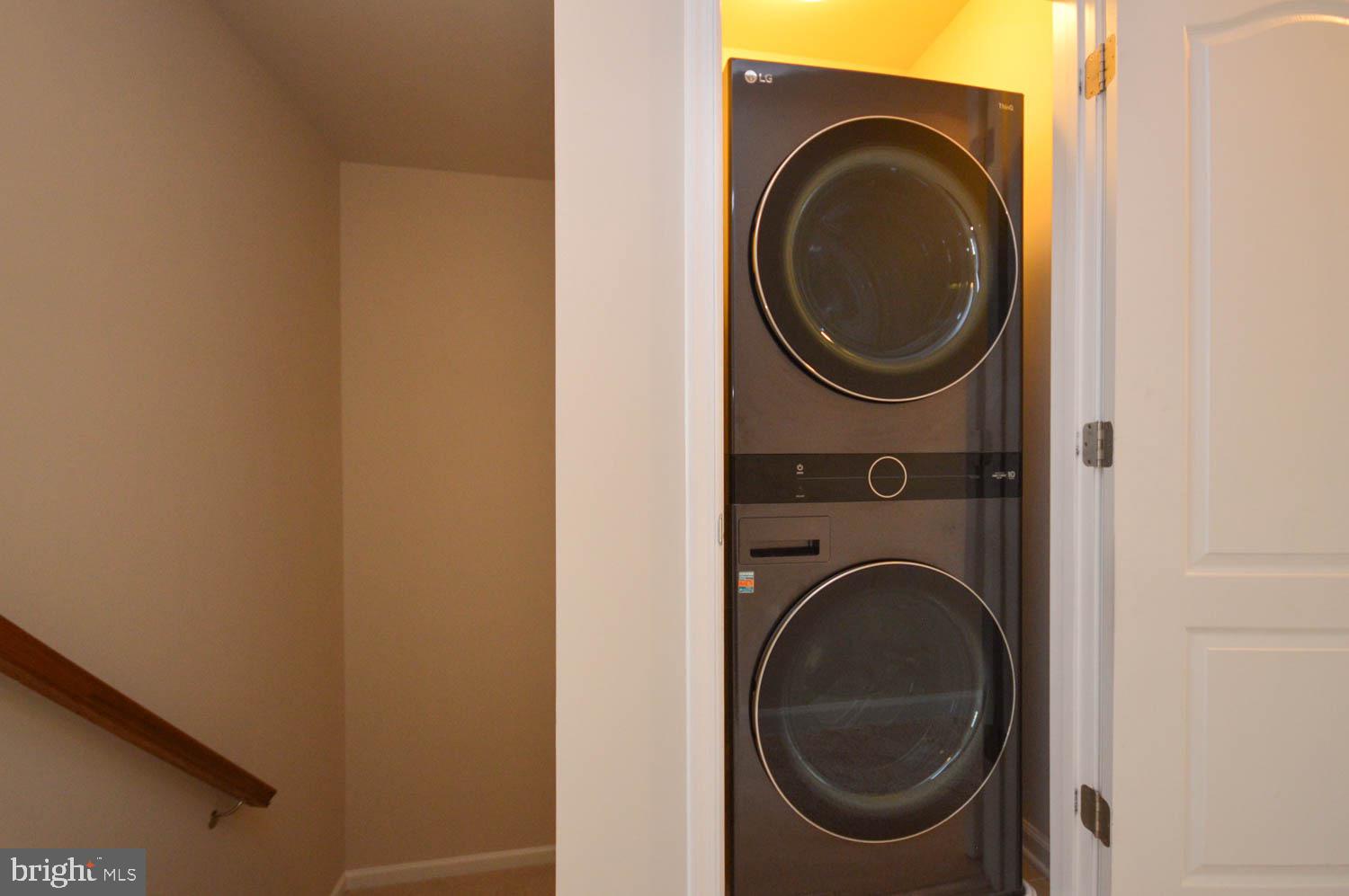 8426 Winding Trail Laurel, MD 20724 - Photo 28 of 41 a close up view of a washer and dryer in a small bathroom
