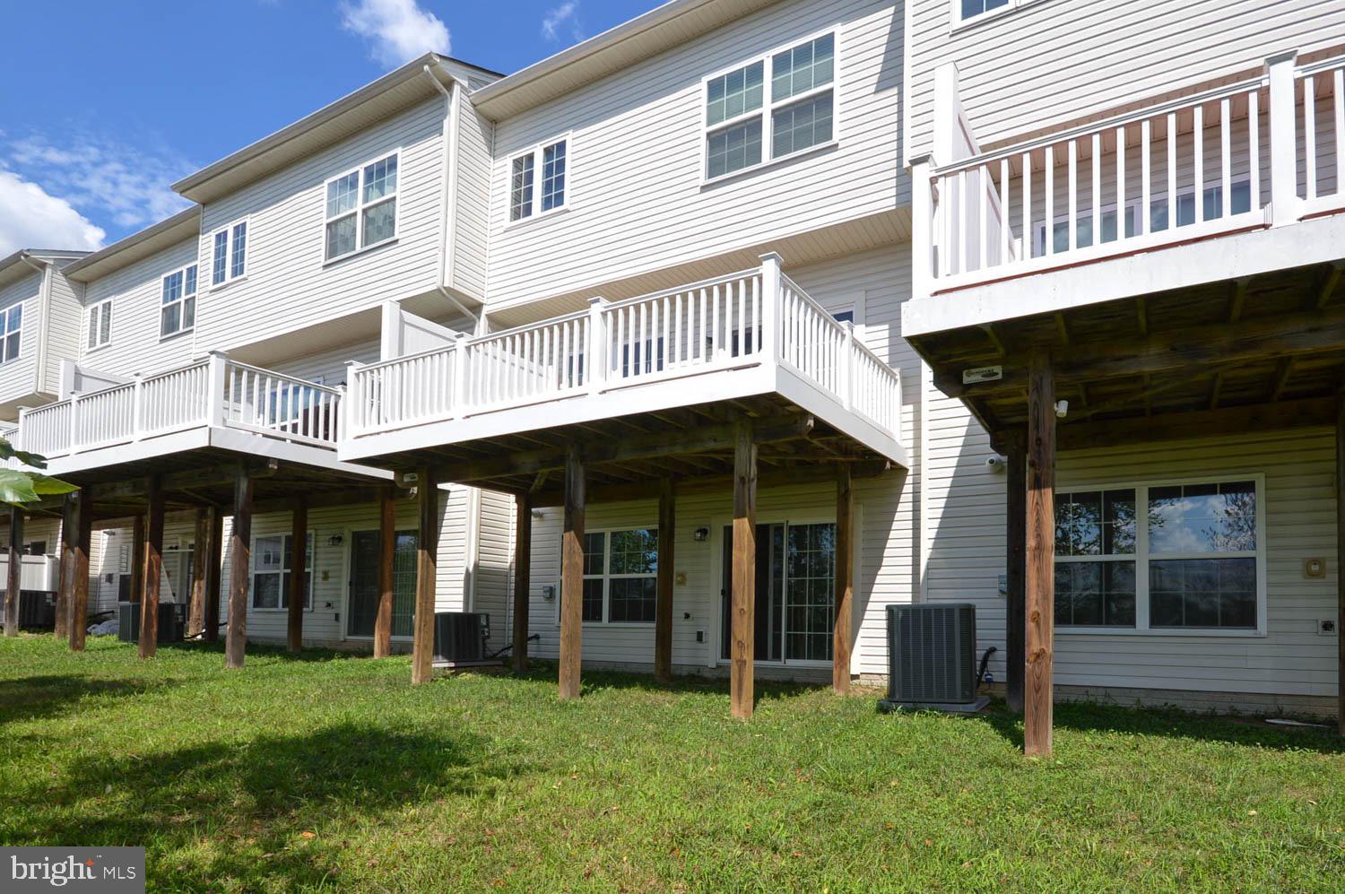 8426 Winding Trail Laurel, MD 20724 - Photo 33 of 41 a view of a large building with a large window and a yard