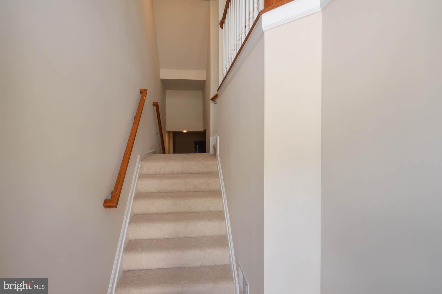 8426 Winding Trail Laurel, MD 20724 - Photo 5 of 41 a view of staircase with white walls