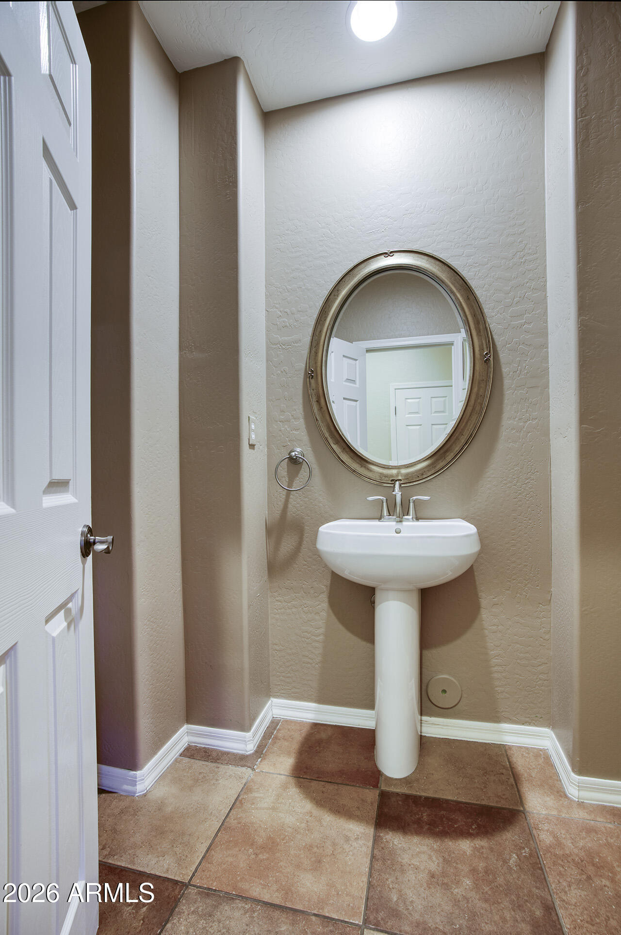 3985 East Hummingbird Lane Phoenix, AZ 85050 - Photo 15 of 47 a bathroom with a sink and mirror