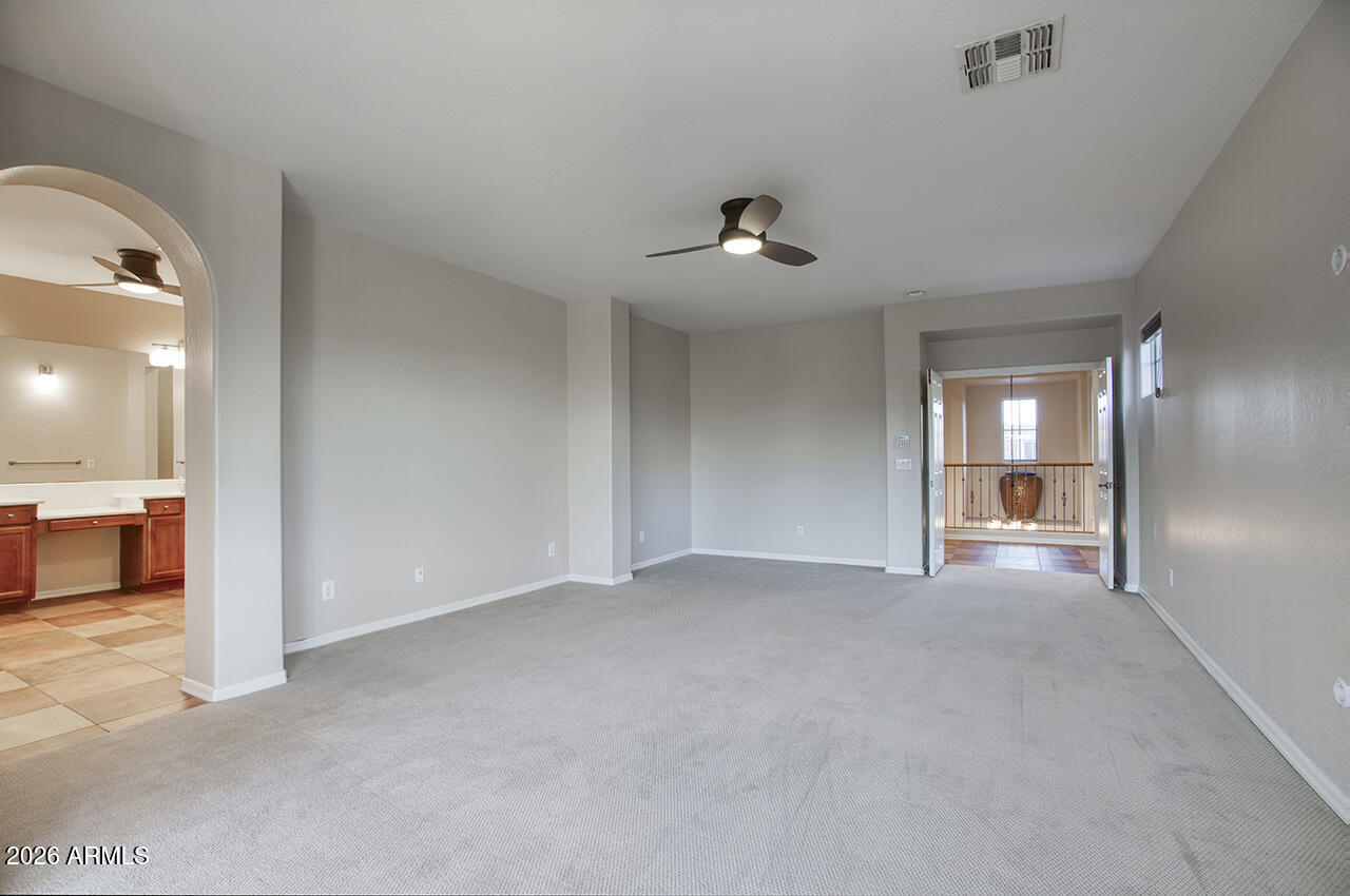 3985 East Hummingbird Lane Phoenix, AZ 85050 - Photo 17 of 47 a view of empty room with a fireplace