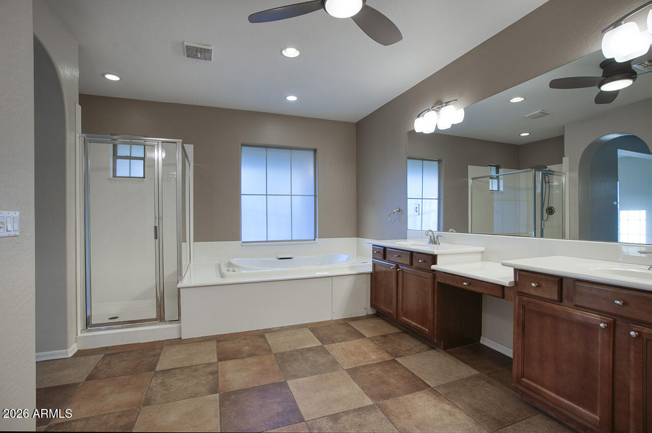 3985 East Hummingbird Lane Phoenix, AZ 85050 - Photo 18 of 47 a large bathroom with a large tub and sink