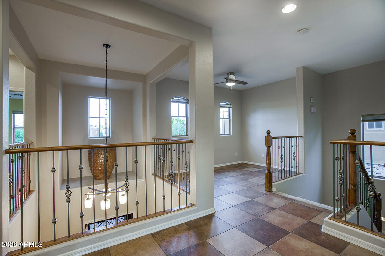 3985 East Hummingbird Lane Phoenix, AZ 85050 - Photo 21 of 47 a view of entryway with stairs and wooden floor