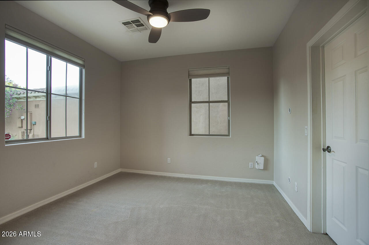 3985 East Hummingbird Lane Phoenix, AZ 85050 - Photo 25 of 47 an empty room with a window