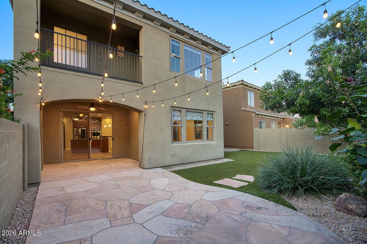 3985 East Hummingbird Lane Phoenix, AZ 85050 - Photo 27 of 47 a view of a house with a yard and potted plants