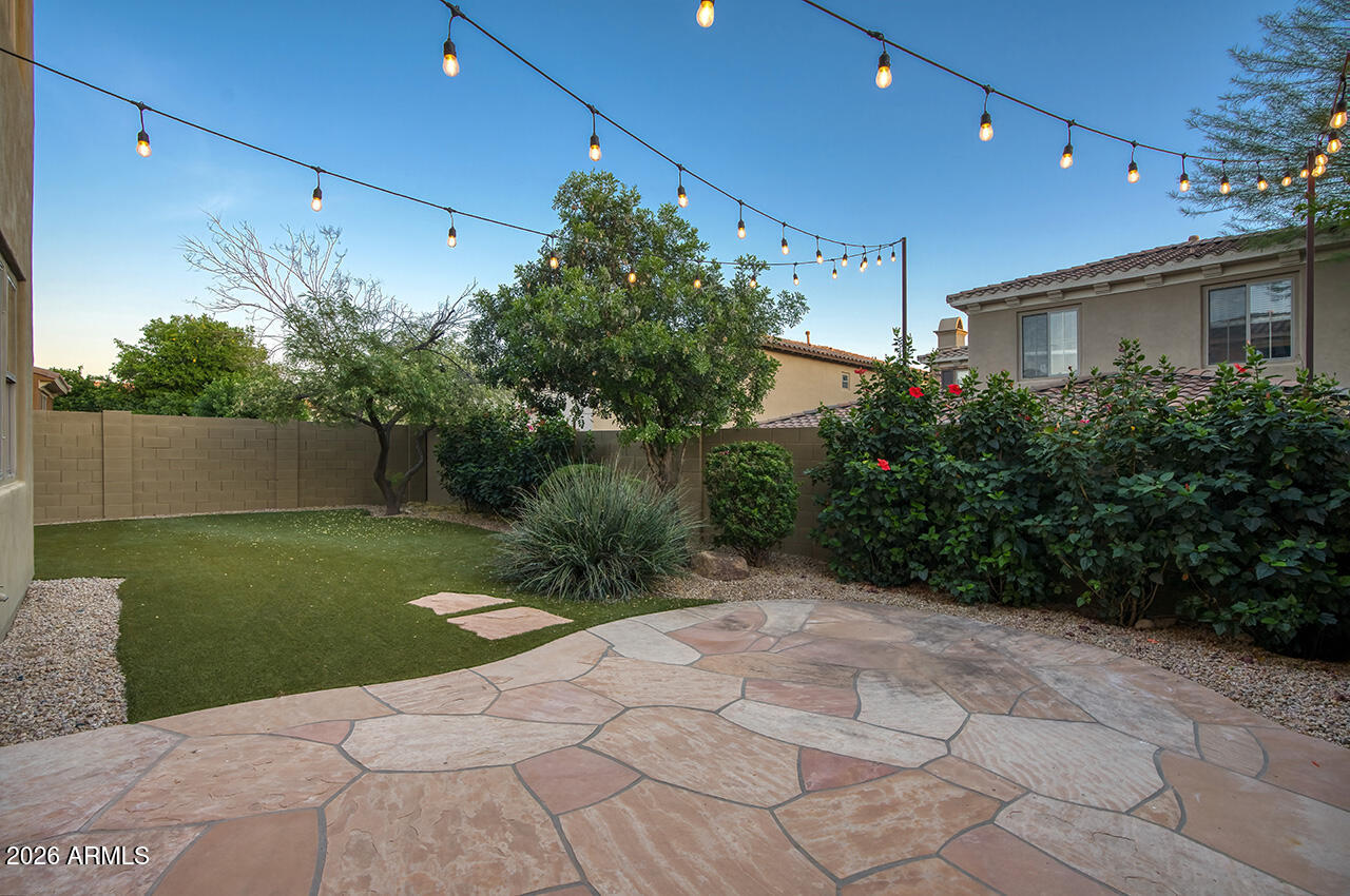 3985 East Hummingbird Lane Phoenix, AZ 85050 - Photo 28 of 47 a view of a house with a yard