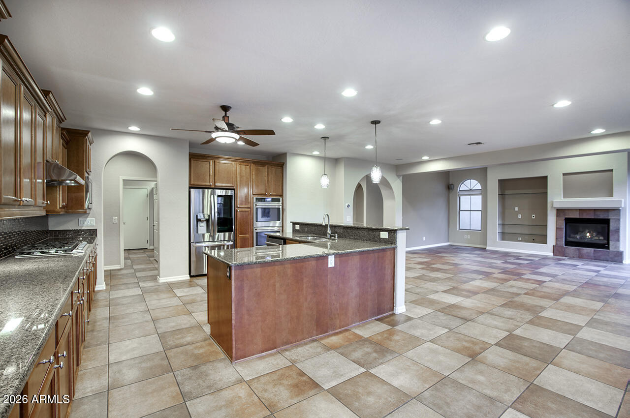 3985 East Hummingbird Lane Phoenix, AZ 85050 - Photo 8 of 47 a large kitchen with stainless steel appliances lots of counter top space