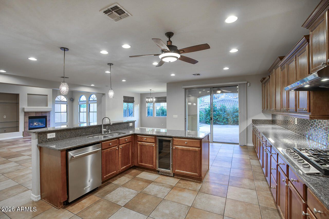 3985 East Hummingbird Lane Phoenix, AZ 85050 - Photo 9 of 47 a kitchen with granite countertop stainless steel appliances a sink and counter space