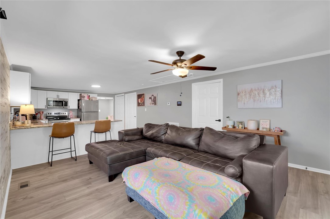 115 May Street Easley, SC 29640 - Photo 4 of 25 Clean lines and smooth flooring define this versatile open living space.