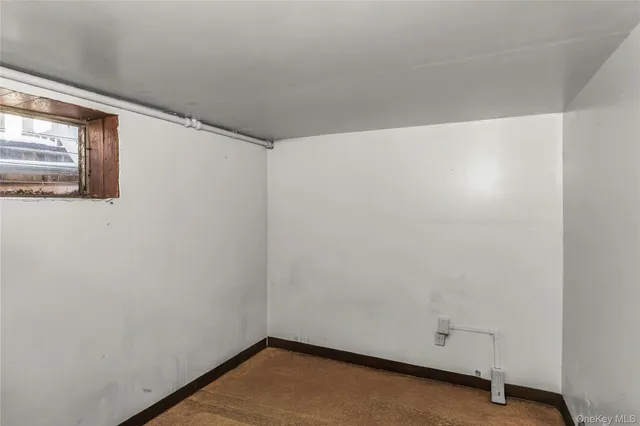 a view of walk in closet with clothes