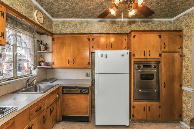 a kitchen with a refrigerator and countertop